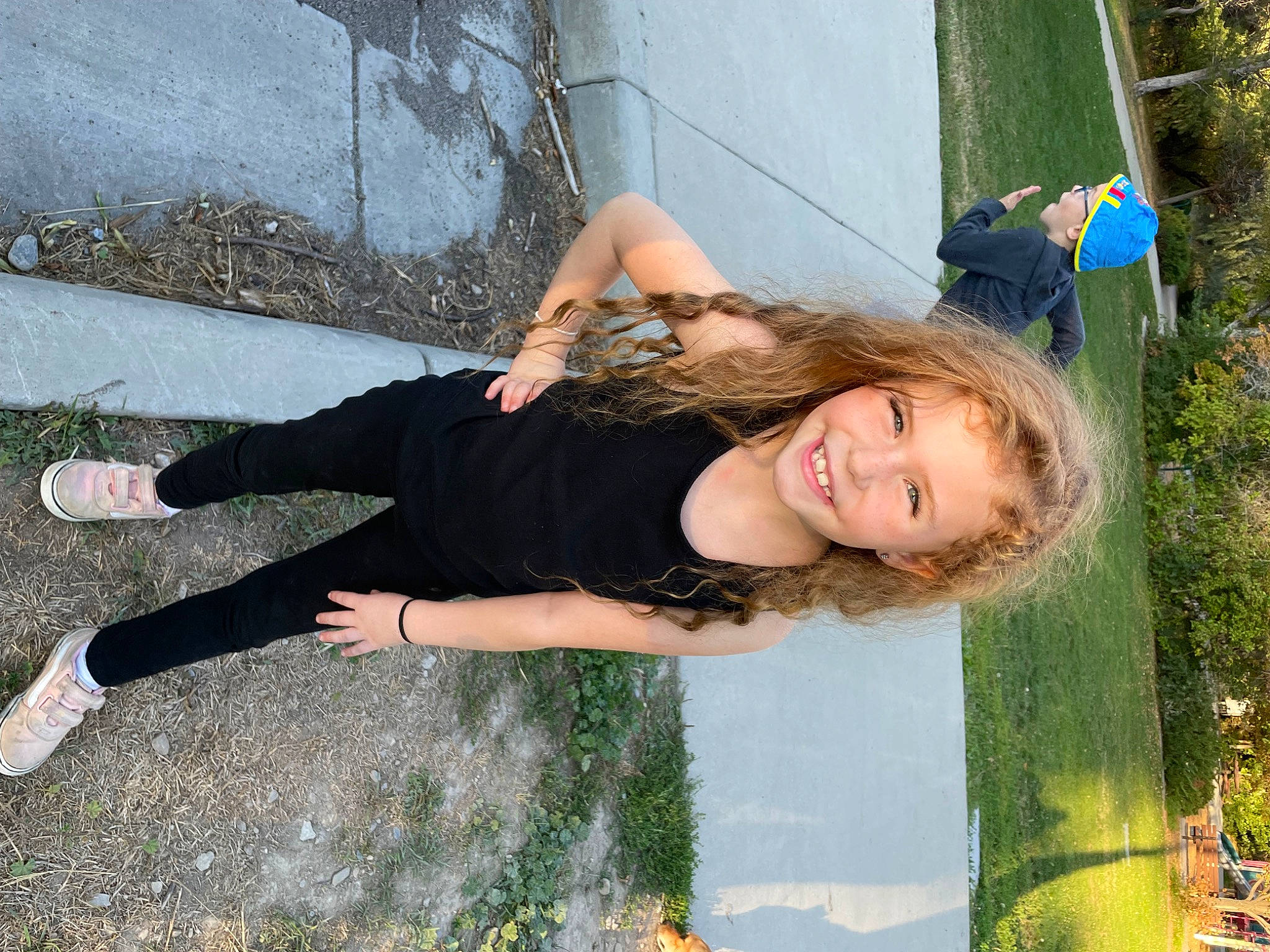 Mckynlie joined the competition — help win amazing prizes! blond, child, flag, fun, grass, happy, human_leg, knee, leisure, long_hair, people_in_nature, person, plant, recreation, sitting, smile, thigh, tree, vacation, water