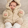 baby, infant, child, fluffy_jacket, bear_ears, hood, boots, soft_rug, blue_eyes, cute, warm_clothing, sitting, portrait, indoor, cozy, fuzzy_texture, small_hands, expression, neutral_face, young