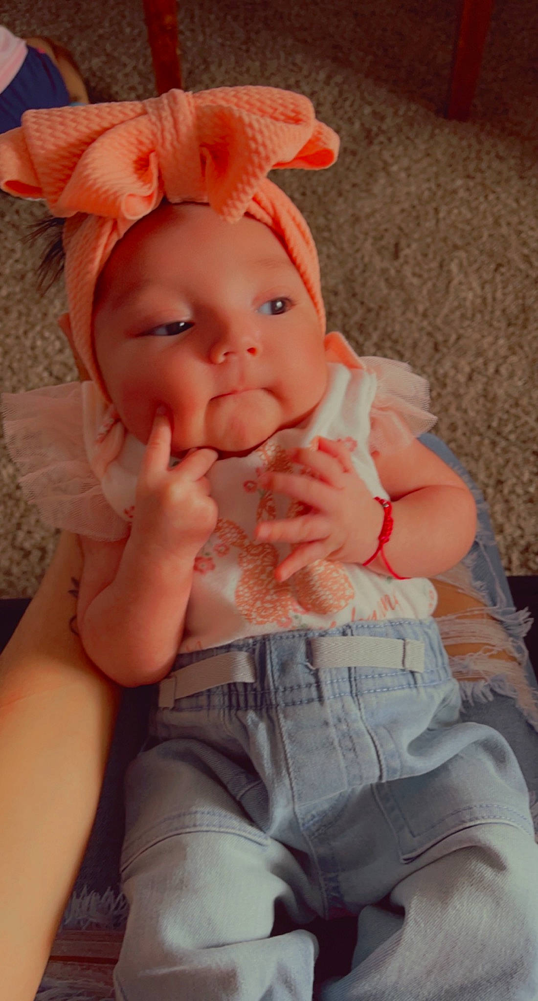 Caroline is registered to the contest to win money with this photo: arm, baby_toddler_clothing, dress, eye, face, gesture, hand, happy, head, headwear, human_body, iris, leg, lip, mouth, muscle, neck, person, pink, skin
