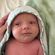 Thomas joined the competition — help win amazing prizes! newborn, baby, infant, face, skin, towel, hooded_towel, hand, expression, portrait, closeup, child, person, soft, blanket, comfort, bed, resting, cute, curious
