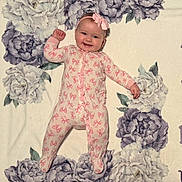 Callie joined the competition — help win amazing prizes! baby, blanket, bow, cheeks, child, cozy, cute, feet, floral_blanket, hand, happy, headband, infant, lying_down, nursery, onesie, pajamas, pink, portrait, smiling