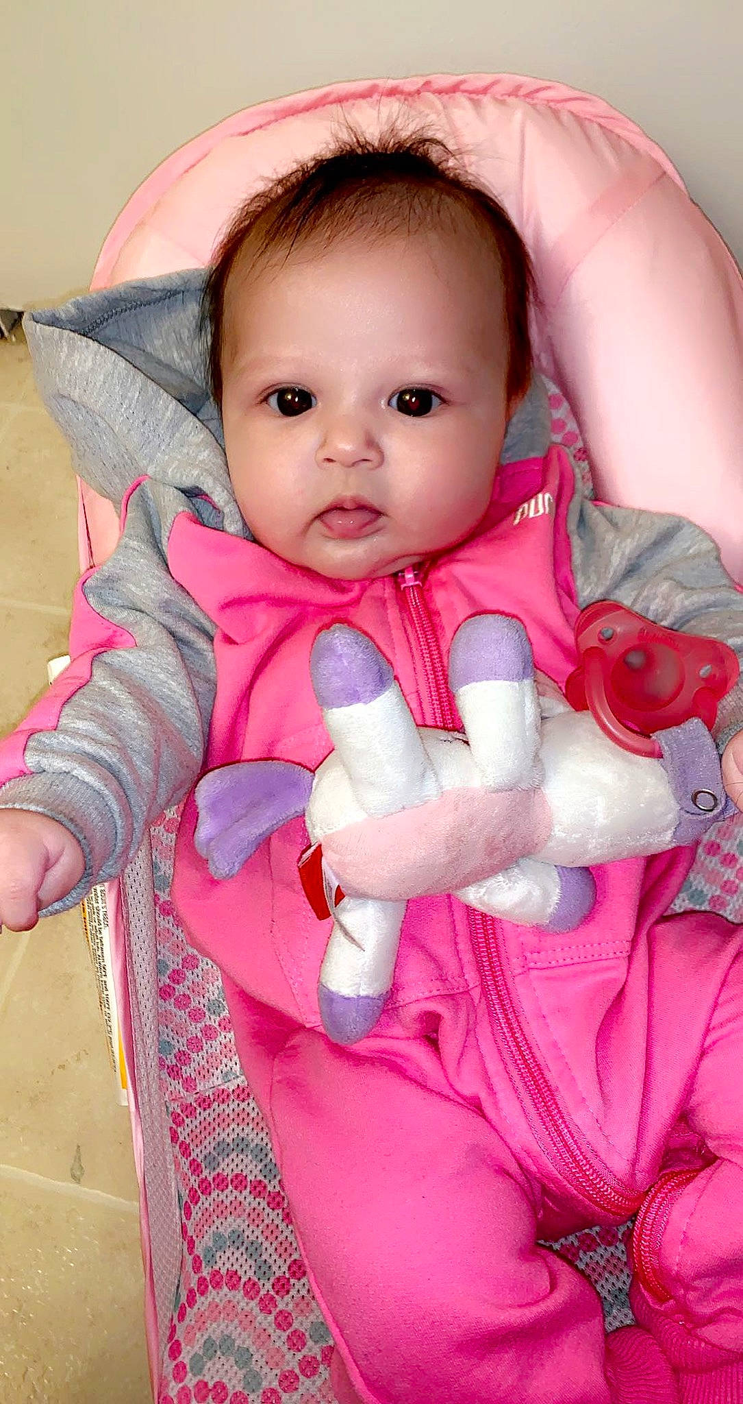 Aiyana is registered to the contest to win money with this photo: baby, baby_products, baby_safety, baby_toddler_clothing, baby_toys, cheek, child, comfort, eye, glove, lip, nose, overall, person, pink, skin, toddler