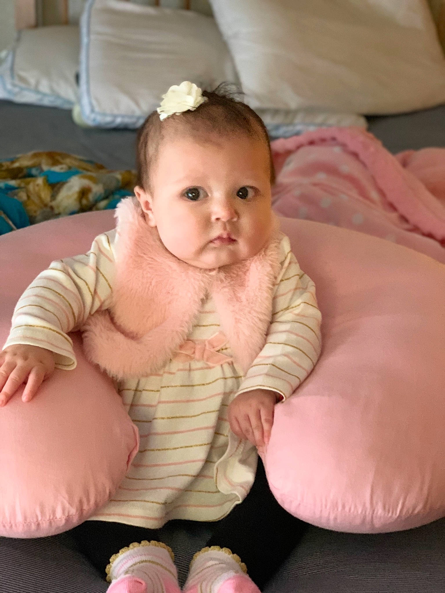 Aiyana joined the competition — help win amazing prizes! baby, baby_toddler_clothing, child, comfort, costume_accessory, couch, foot, hair_accessory, headband, headpiece, home_accessories, human_body, linens, living_room, person, pink, sitting, sock, throw_pillow, toddler