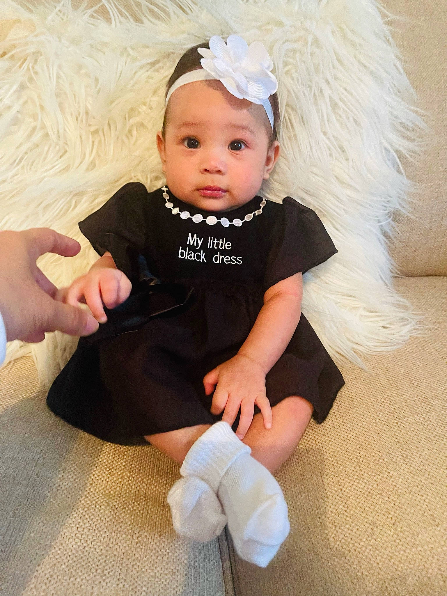 Isabella Rae is registered to the contest to win money with this photo: arm, baby, baby_toddler_clothing, child, costume_hat, eye, finger, flash_photography, headband, headpiece, headwear, human_leg, iris, jewellery, knee, person, pink, skin, sleeve, sock