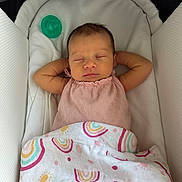Ava joined the competition — help win amazing prizes! baby, sleeping, blanket, rainbow_pattern, infant, peaceful, face, arms, pink_clothing, crib, soft, cute, resting, newborn, child, indoors, comfort, cozy, relaxed, nap
