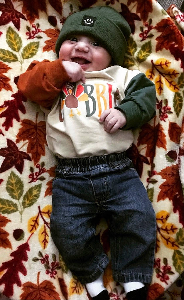 Luka joined the competition — help win amazing prizes! baby, baby_toddler_clothing, cap, child, grass, green, happy, headwear, leaf, linens, pattern, people_in_nature, person, plaid, plant, sleeve, smile, t_shirt, textile, toddler