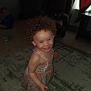 Neveah joined the competition — help win amazing prizes! barefoot, boy, carpet, child, curly_hair, curtain, curtains, dress, furniture, happy, home, indoor, living_room, person, playful, rug, sitting, smiling, toddler, window