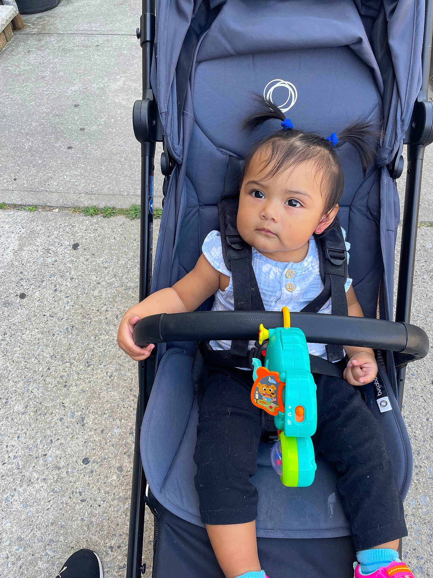 Valentina is registered to the contest to win money with this photo: accessories, baby, buggy, city, clothing, face, footwear, head, person, photography, portrait, road, shoe, street, stroller, sunglasses, toy, transportation, urban, vehicle