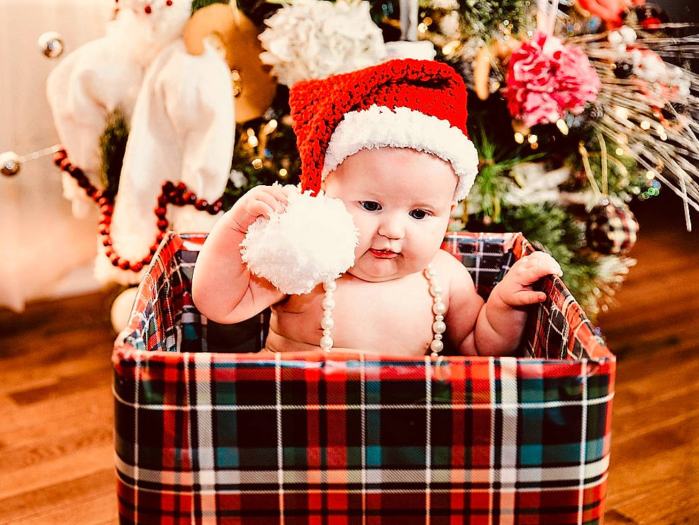 June joined the competition — help win amazing prizes! baby, baby_toddler_clothing, child, christmas_ornament, event, grass, happy, hat, holiday, ornament, pattern, person, plaid, red, santa_claus, skin, smile, tartan, textile, toddler