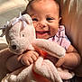 Malia joined the competition — help win amazing prizes! baby, smile, teddy_bear, plush_toy, pink, child, happy, cute, infant, cuddly, soft, light, warm, cozy, portrait, hands, face, clothing, bed, blanket