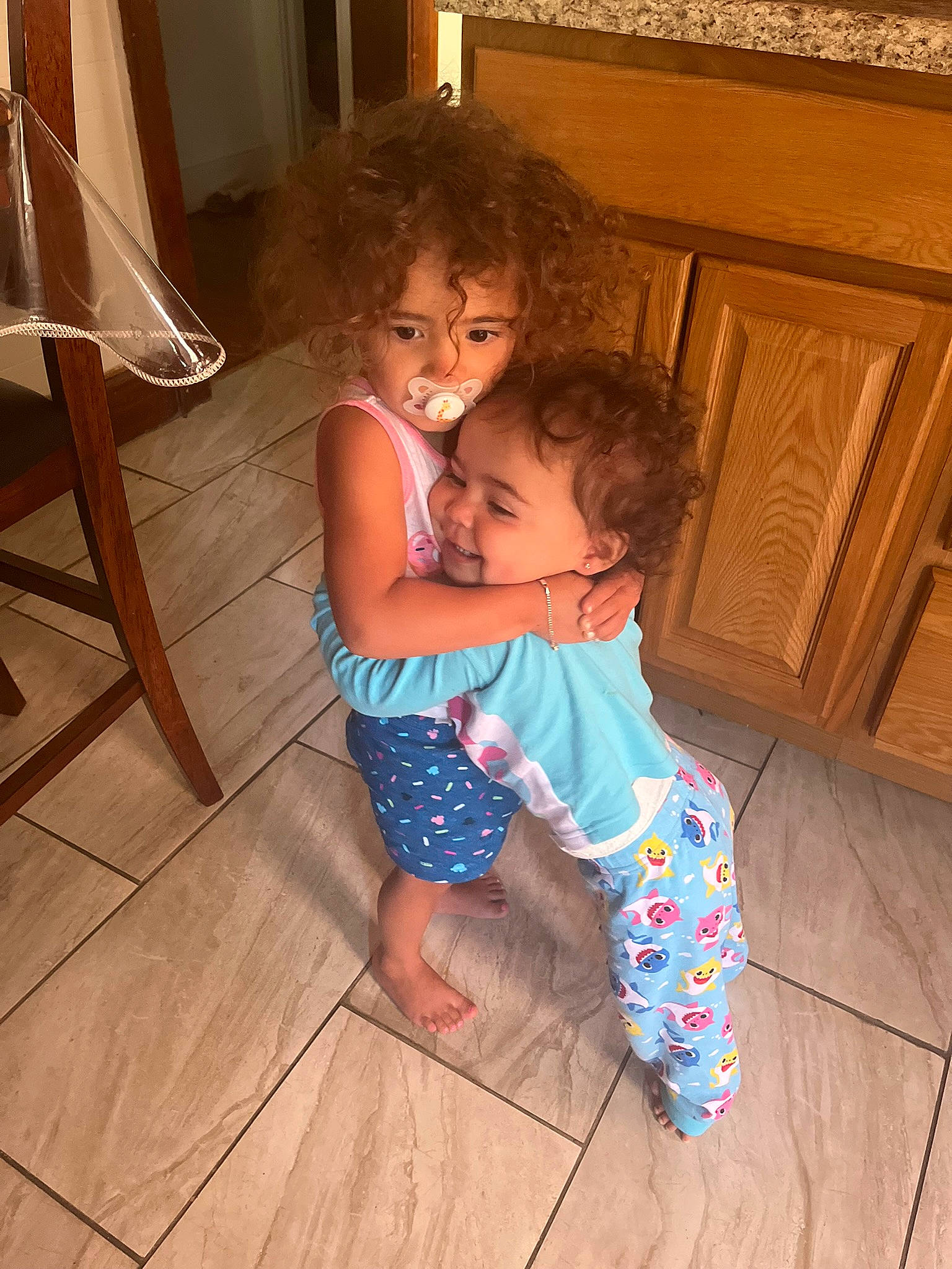 Myliana is registered to the contest to win money with this photo: baby_toddler_clothing, cabinetry, comfort, floor, flooring, foot, fun, hair, hairstyle, happy, hardwood, laminate_flooring, leisure, person, shoulder, sitting, skin, toddler, varnish, wood