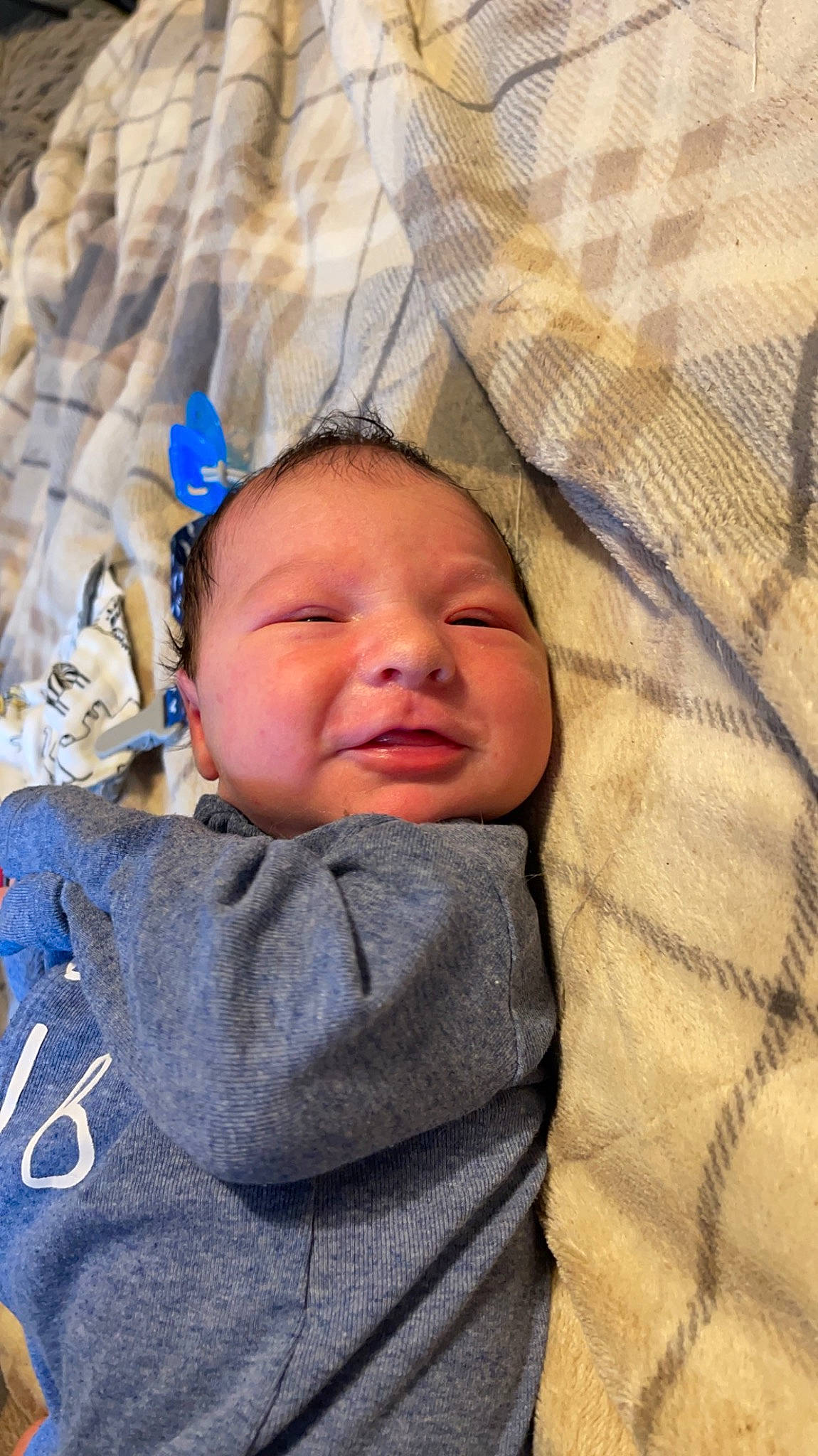 Mason is registered to the contest to win money with this photo: baby, baby_toddler_clothing, bedtime, cheek, child, comfort, facial_expression, grass, happy, linens, pattern, person, skin, sleep, smile, textile, toddler