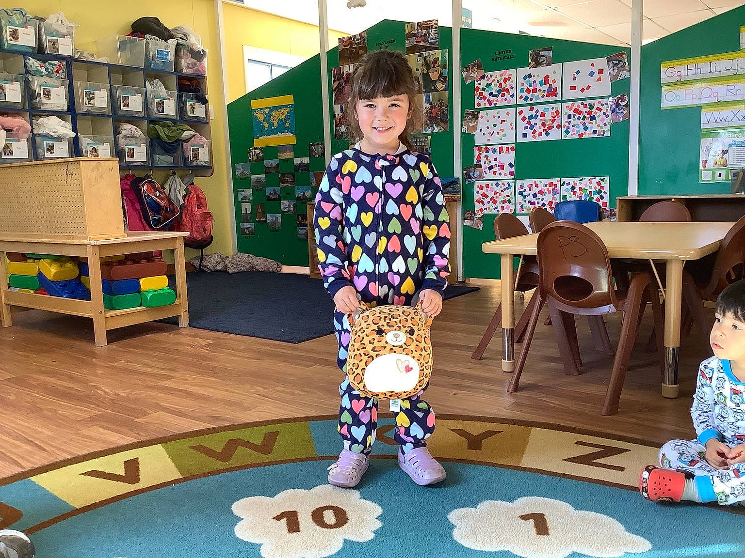 Zelda joined the competition — help win amazing prizes! carpet, chair, child, flooring, fun, games, joy, kindergarten, learning, leisure, person, play, recreation, room, school, sharing, shelf, smile, table, toddler