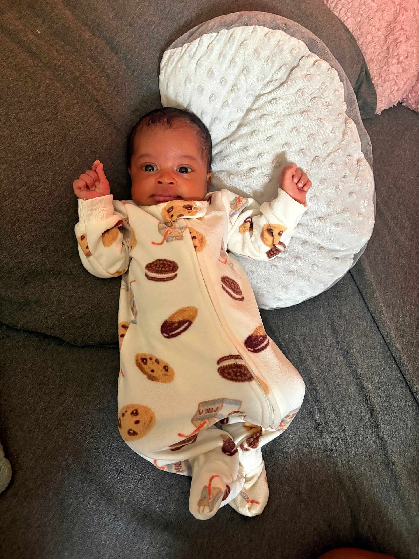 Ka'Tori joined the competition — help win amazing prizes! baby, infant, onesie, cookie_pattern, pillow, couch, sofa, fabric, face, person, sleepwear, baby_clothing, indoors, cute, newborn, resting, raised_hands, texture, soft, comfort