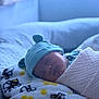 baby, newborn, sleeping, hat, blanket, bee_pattern, cozy, soft, indoors, resting, peaceful, infant, wrapped, cute, child, portrait, comfort, warm, headwear, bed