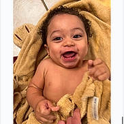 Kjg joined the competition — help win amazing prizes! baby, child, towel, smiling, happy, curly_hair, skin, hand, face, indoors, floor, tile, cute, infant, person, joy, expression, warmth, soft, playful