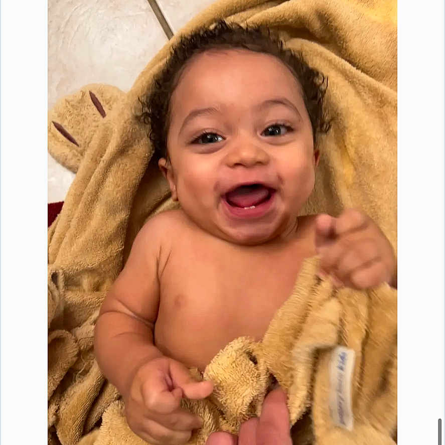Kjg joined the competition — help win amazing prizes! baby, child, curly_hair, cute, expression, face, floor, hand, happy, indoors, infant, joy, person, playful, skin, smiling, soft, tile, towel, warmth
