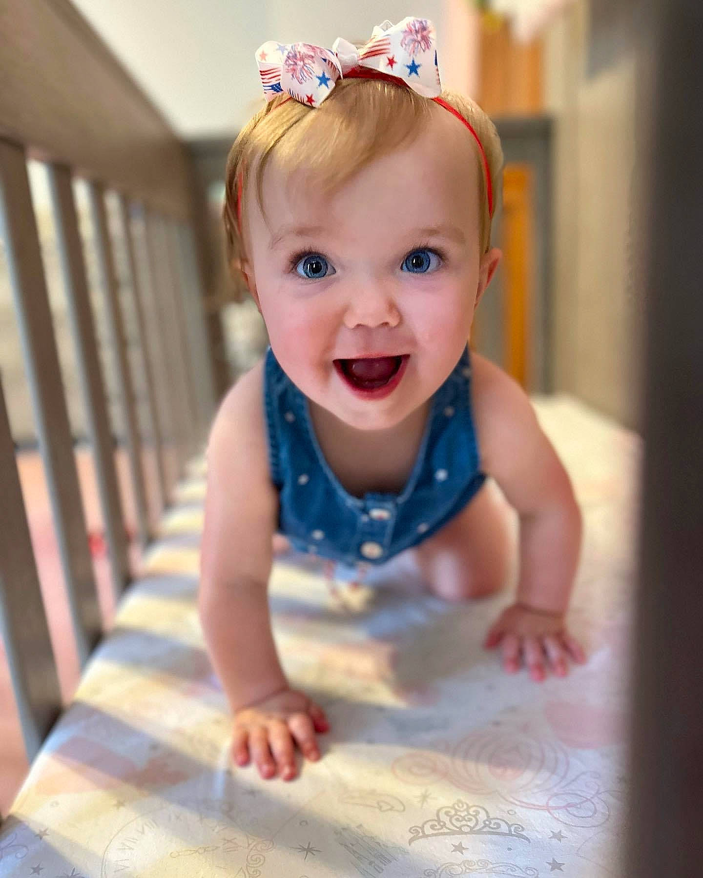 Hadley is registered to the contest to win money with this photo: baby, baby_toddler_clothing, cheek, child, eye, face, floor, flooring, fun, hair, happy, head, headband, headpiece, iris, person, skin, sleeve, smile, tiara