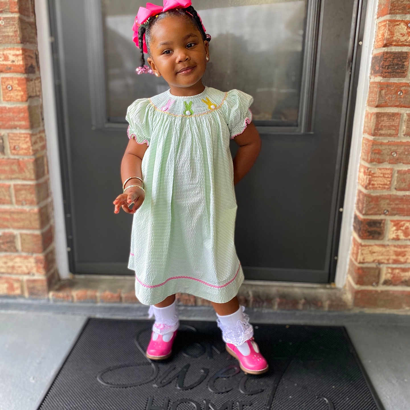 Kailani-Madison joined the competition — help win amazing prizes! child, clothing, costume, door, doormat, dress, face, female, footwear, girl, head, mat, pants, person, photography, portrait, sandal, shoe, sleeve, standing