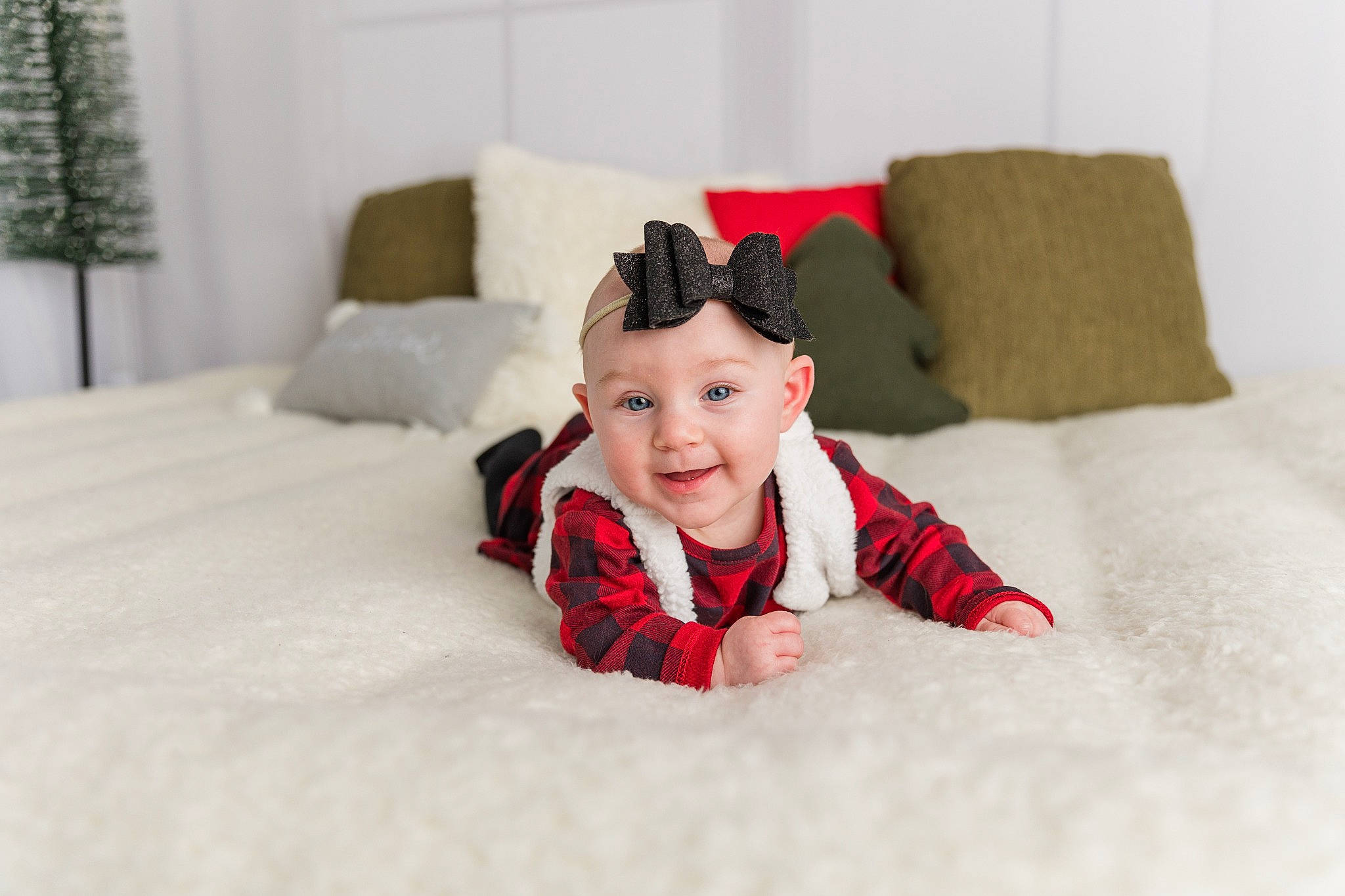 Lorelei is registered to the contest to win money with this photo: baby_toddler_clothing, bedding, carmine, comfort, couch, flash_photography, floor, flooring, fur, furniture, happy, hardwood, head, headwear, linens, pattern, person, room, sleeve, smile
