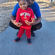 Tianna joined the competition — help win amazing prizes! child, toddler, adult, smiling, outdoor, sidewalk, casual_clothing, red_hoodie, mickey_mouse, cap, black_shoes, grass, house, daylight, person, happy, family, supporting, posing, nature