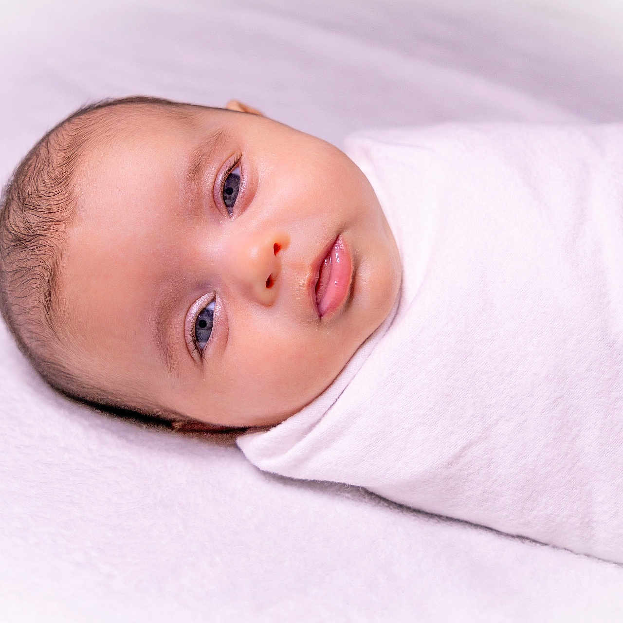 Stormi joined the competition — help win amazing prizes! baby, blanket, bodypart, clothing, face, finger, hand, happy, head, longsleeve, mouth, newborn, person, photography, portrait, sleeve, smile, towel