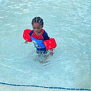 Willie joined the competition — help win amazing prizes! blue, braided_hair, child, floaties, fun, kid, outdoor, person, play, pool, recreation, red, ripples, safety, steps, summer, swim_shirt, swimming, water, young_child