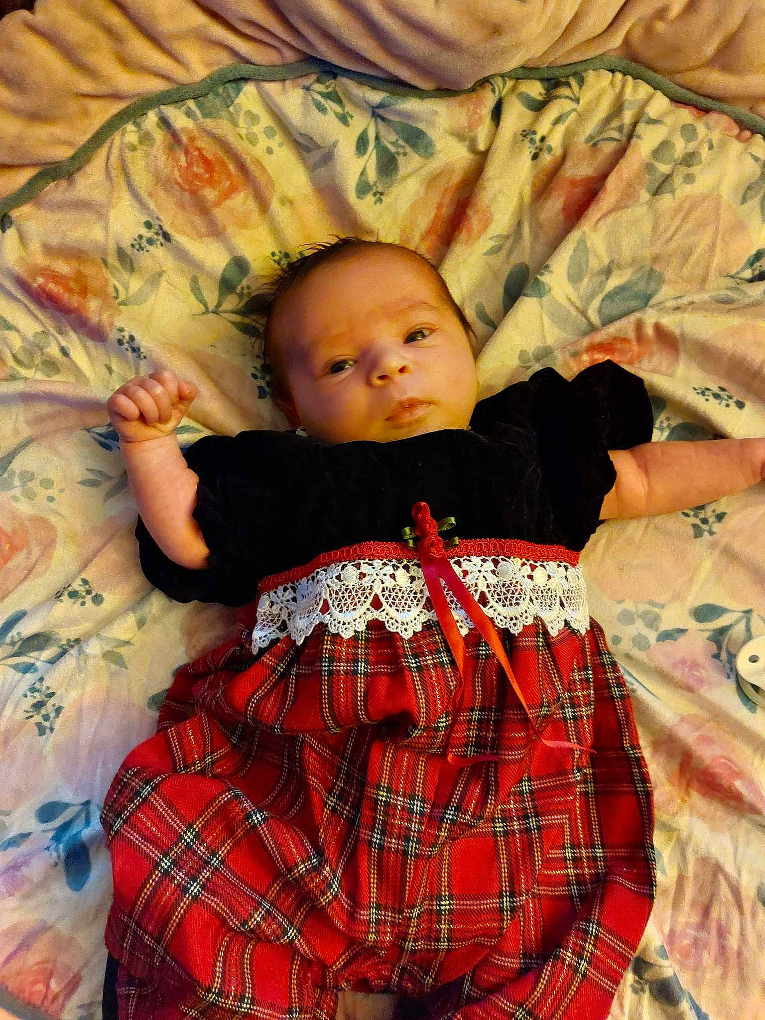 Lilliana is registered to the contest to win money with this photo: baby, baby_toddler_clothing, cheek, child, comfort, design, hairstyle, lap, linens, mammal, pattern, person, plaid, product, sitting, skin, sleeve, tartan, textile, toddler