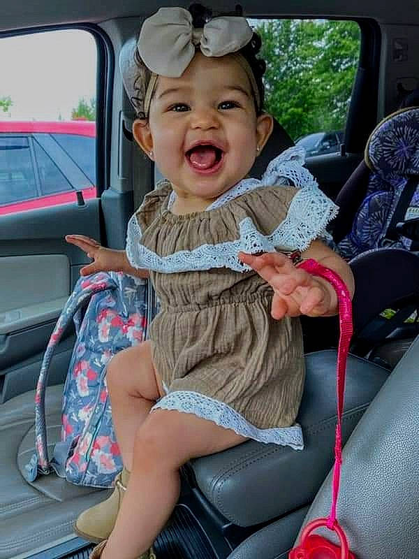 Kynslee joined the competition — help win amazing prizes! auto_part, automotive_exterior, baby_carriage, baby_in_car_seat, baby_products, car, car_seat, car_seat_cover, child, family_car, finger, headwear, person, product, seat_belt, sitting, smile, toddler, vehicle