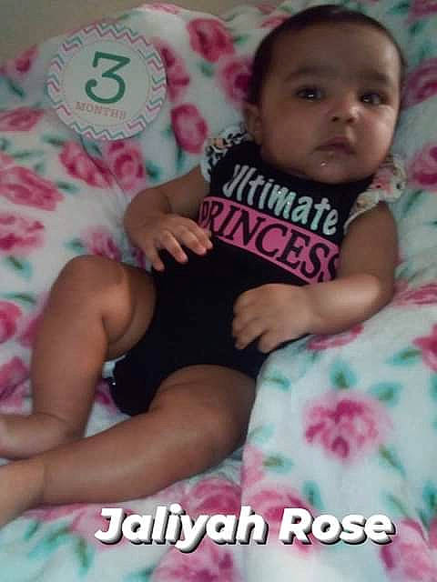 Jaliyah joined the competition — help win amazing prizes! arm, baby, baby_toddler_clothing, cheek, child, comfort, finger, happy, linens, magenta, nail, pattern, person, pink, sitting, skin, smile, textile, thigh, thumb