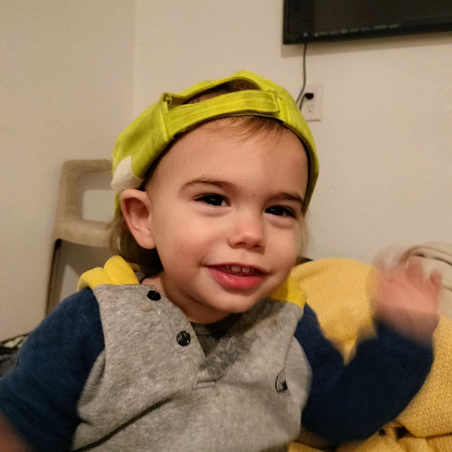 Robby is registered to the contest to win money with this photo: baby, baseballcap, bodypart, cap, clothing, computerhardware, couch, electronics, face, finger, furniture, hand, hardware, hat, head, monitor, person, photography, portrait, screen