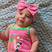Asher joined the competition — help win amazing prizes! baby, infant, child, pink_bow, headband, minnie_mouse, pink_outfit, sleeveless, patterned_blanket, cute, smiling, portrait, lying_down, closeup, bright_colors, skin, face, arm, hand, eyes