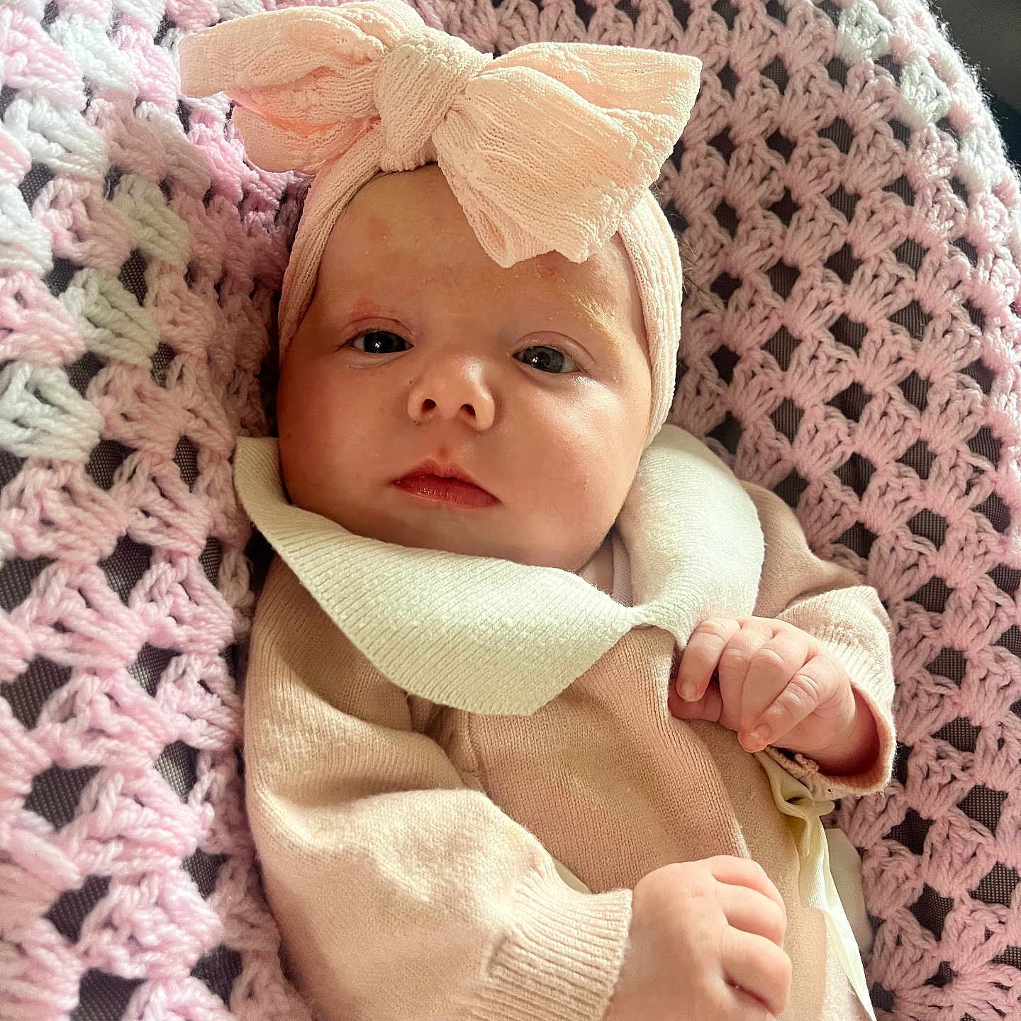 Naliah joined the competition — help win amazing prizes! baby, bow, child, closeup, clothing, cozy, cute, face, hand, headband, indoor, infant, knitted_blanket, newborn, person, pink, portrait, relaxed, sleepy, soft_texture