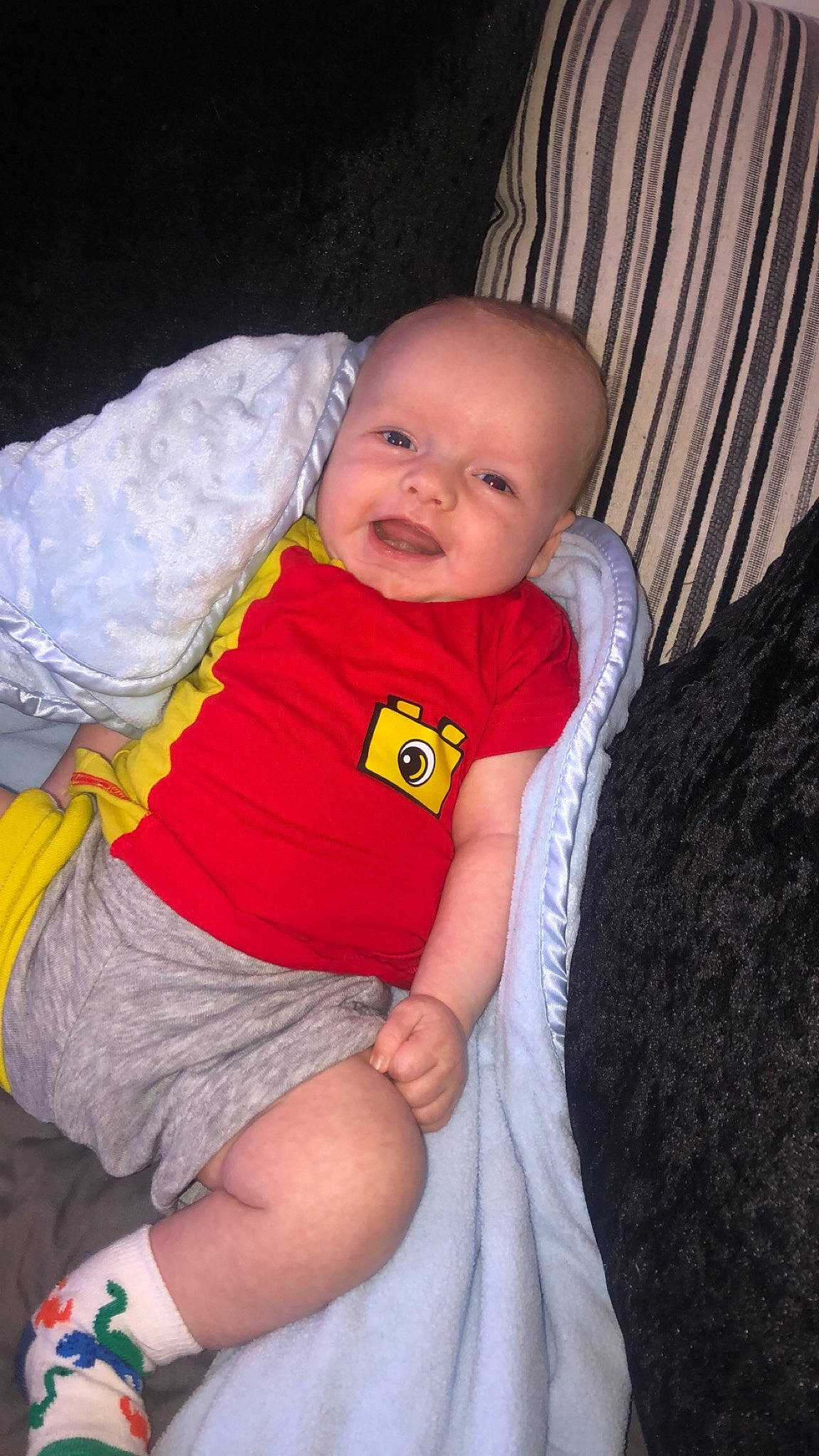 Kyren is registered to the contest to win money with this photo: baby, baby_toddler_clothing, cheek, child, comfort, eye, face, grass, happy, human_leg, leg, lip, nose, person, shorts, skin, sleeve, smile, thigh, toddler