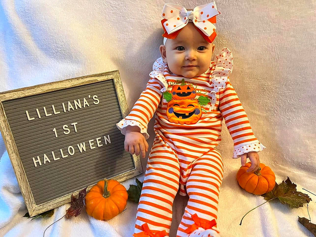 Lilliana joined the competition — help win amazing prizes! baby_toddler_clothing, calabaza, cucurbita, dress, facial_expression, gourd, happy, head, headwear, joy, natural_foods, orange, organ, people, person, photograph, plant, pumpkin, smile, squash