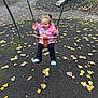 child, toddler, swing, playground, autumn, leaves, jacket, black_pants, blue_shoes, slide, bench, outdoor, park, happy, smiling, play, fun, daylight, person, recreation