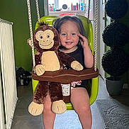 Bonnie joined the competition — help win amazing prizes! toddler, child, indoor, swing, plush_toy, monkey_toy, smile, happy, green_swing, window, floor, barefoot, toy, plant, decor, room, child_safety_seat, rope, radiator, casual_clothing