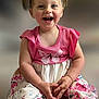 toddler, child, smiling, pink_clothing, dress, flower_hair_clips, butterfly, sitting, toys, happy, playful, indoor, portrait, cute, hands, striped_leggings, colorful, young_child, person, baby