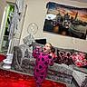 Bonnie-Leigh is registered to the contest to win money with this photo: child, girl, pajamas, bubbles, living_room, sofa, cushions, red_carpet, tablet, painting, door, robe, holiday_decor, window, joy, play, indoor, home, smile, fun