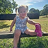 Bonnie-Leigh is registered to the contest to win money with this photo: child, toddler, pigtails, pink_shoes, bench, grass, park, outdoor, sunny, daylight, smile, happy, nature, trees, blue_sky, casual_clothing, summer, playful, person, portrait