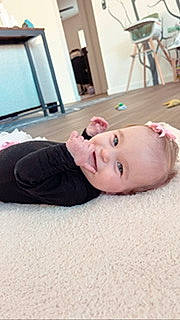 Ella joined the competition — help win amazing prizes! chair, child, comfort, eyelash, floor, flooring, fun, fur, hardwood, jaw, joy, linens, nose, person, room, selfie, sitting, sleeve, toddler, wood