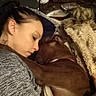 Zena is registered to the contest to win money with this photo: blanket, brown_dog, child, close_up, coffee_table, couch, cozy, cuddling, dog, fluffy_blanket, home, human, indoors, peaceful, pet, portrait, resting, sleeping, snuggling, warm_lighting