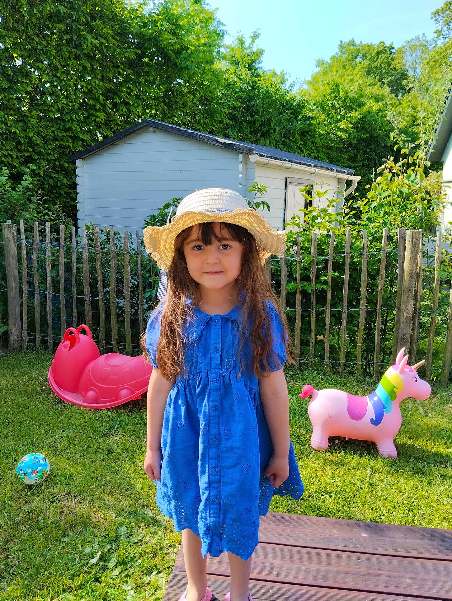 Mya participe au concours pour gagner de l'argent avec cette photo : botany, dress, fawn, fence, grass, green, happy, hat, headgear, headwear, leisure, magenta, people_in_nature, person, pink, plant, recreation, sky, summer, sun_hat
