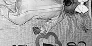 Ava is registered to the contest to win money with this photo: baby, sleeping, onesie, bow, headband, pacifier, blanket, milestone, numbers, days, infant, child, cozy, cute, peaceful, portrait, black_and_white, fabric, resting, closeup