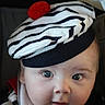 baby, beret, hat, red_pom_pom, striped_clothing, bib, face, cheeks, blue_eyes, portrait, infant, closeup, cute, curious, soft_lighting, indoor, child, young_baby, clothing, smile