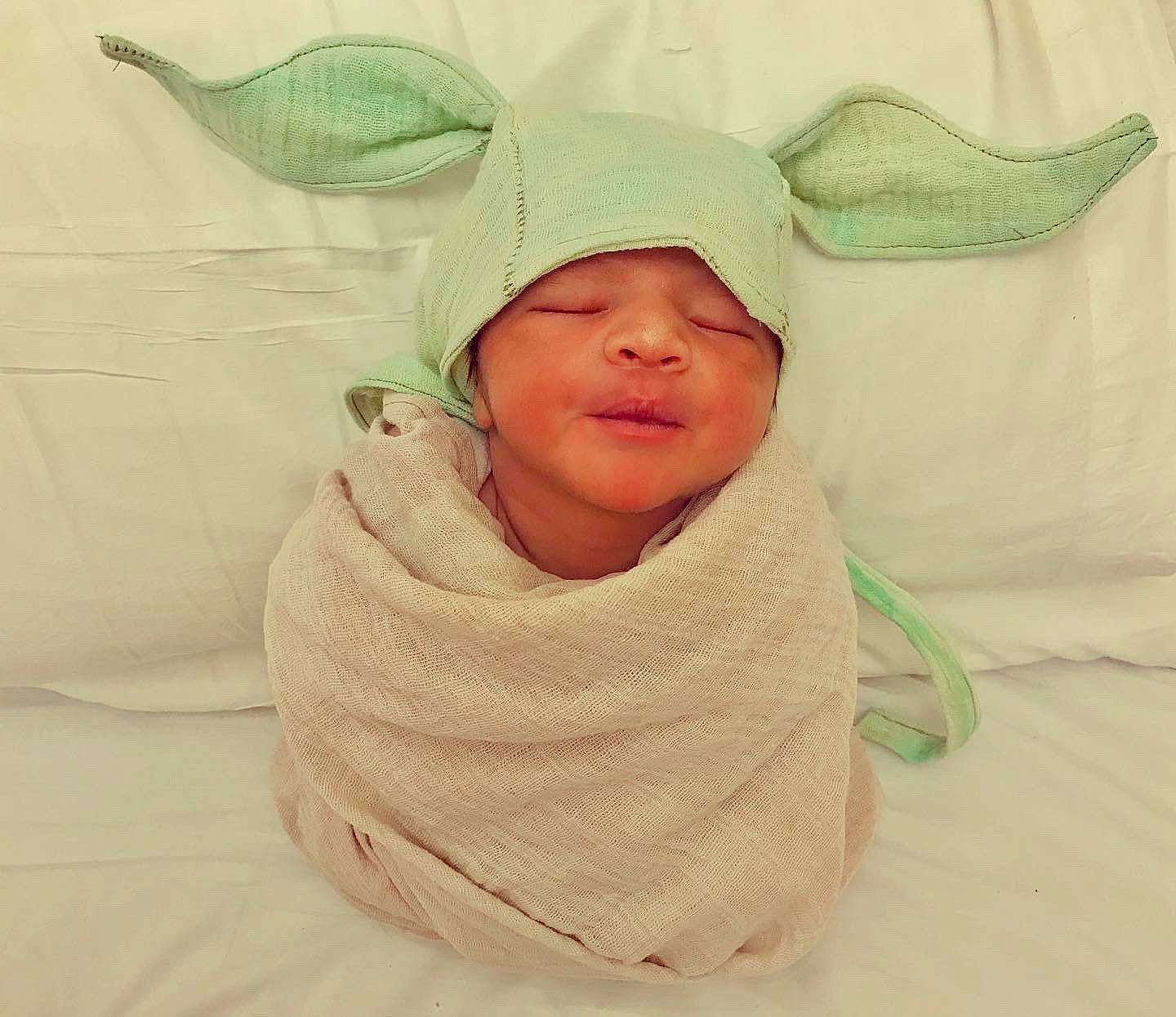 Lee is registered to the contest to win money with this photo: baby, baby_products, baby_toddler_clothing, bonnet, costume, costume_accessory, costume_hat, fictional_character, headwear, hood, hoodie, linens, mythical_creature, person, skin