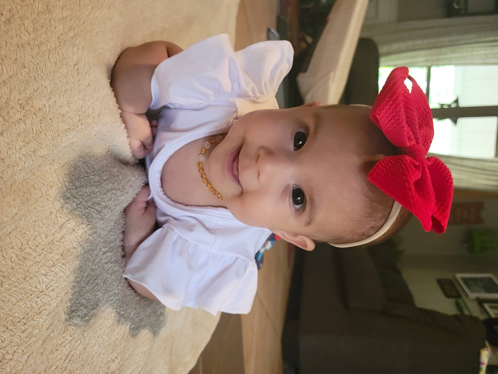 Nayeli is registered to the contest to win money with this photo: baby, baby_toddler_clothing, cheek, child, dress, eye, eyelash, face, fun, happy, hat, headgear, iris, joy, lip, mouth, nose, person, skin, sleeve