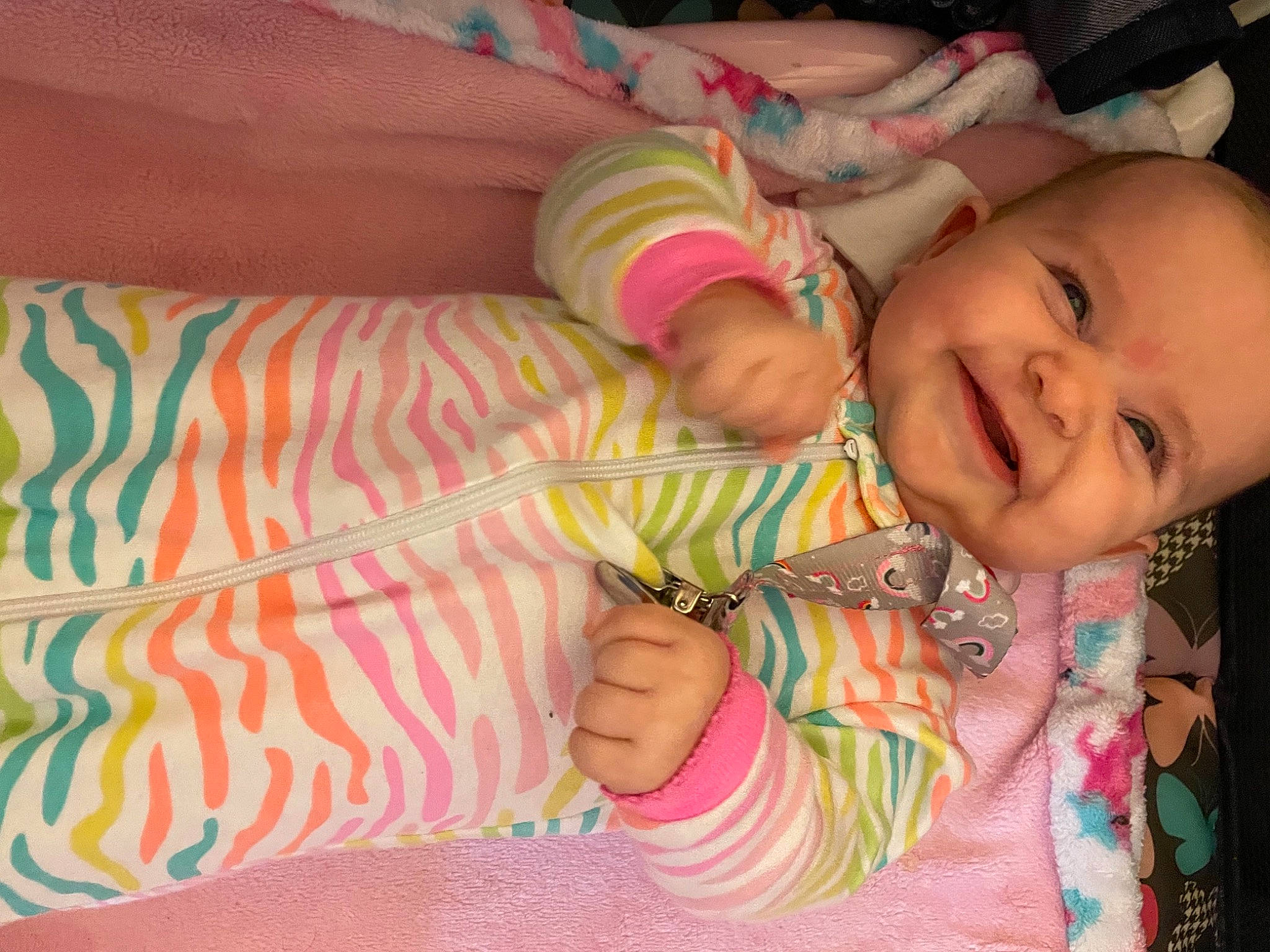 Emberly is registered to the contest to win money with this photo: arm, baby_toddler_clothing, cheek, eye, facial_expression, hand, happy, head, human_body, iris, joy, leg, lip, mammal, mouth, nose, person, pink, skin, smile