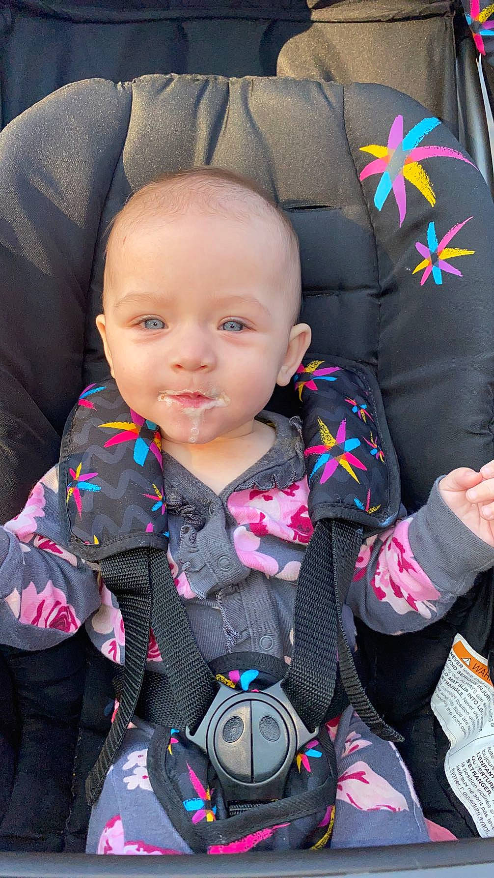 Nylah is registered to the contest to win money with this photo: auto_part, baby, baby_carriage, baby_toddler_clothing, car_seat, cheek, comfort, cool, face, facial_expression, hairstyle, head, outerwear, person, pink, product, skin, sleeve, textile, toddler