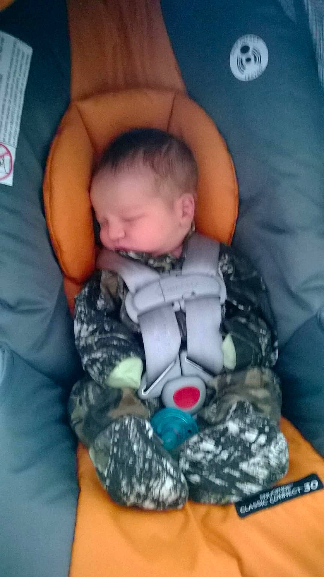 Brantley is registered to the contest to win money with this photo: arm, baby, baby_carriage, baby_in_car_seat, baby_products, baby_sleeping, birth, car_seat, child, comfort, head, nap, person, play, product, sleep, toddler